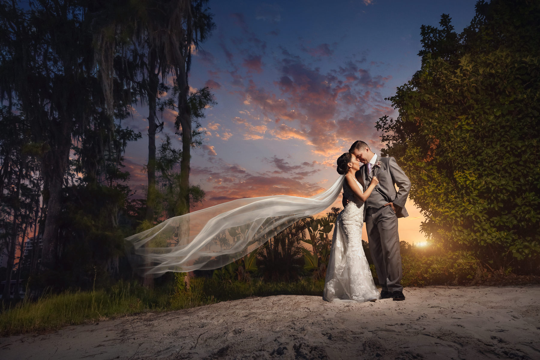 Magical Paradise Cove Orlando Wedding | epic portrait of bride and groom during sunset